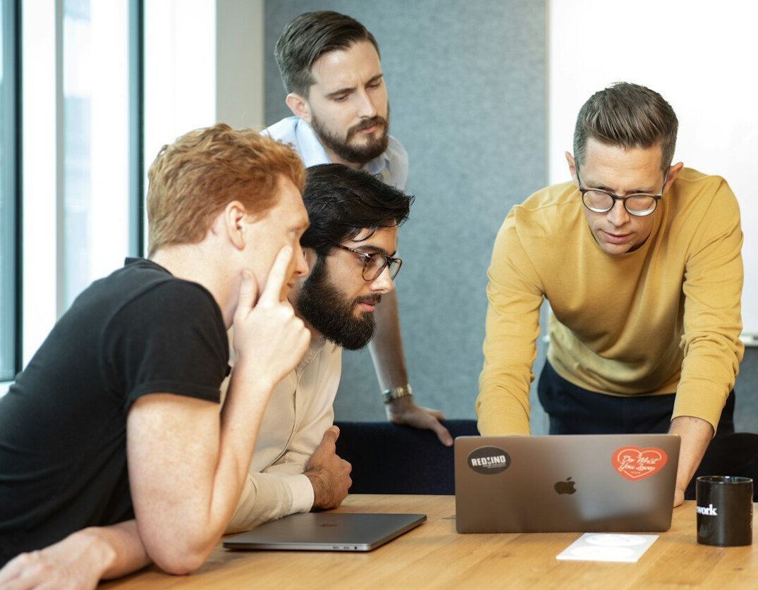 diverse group discussing code