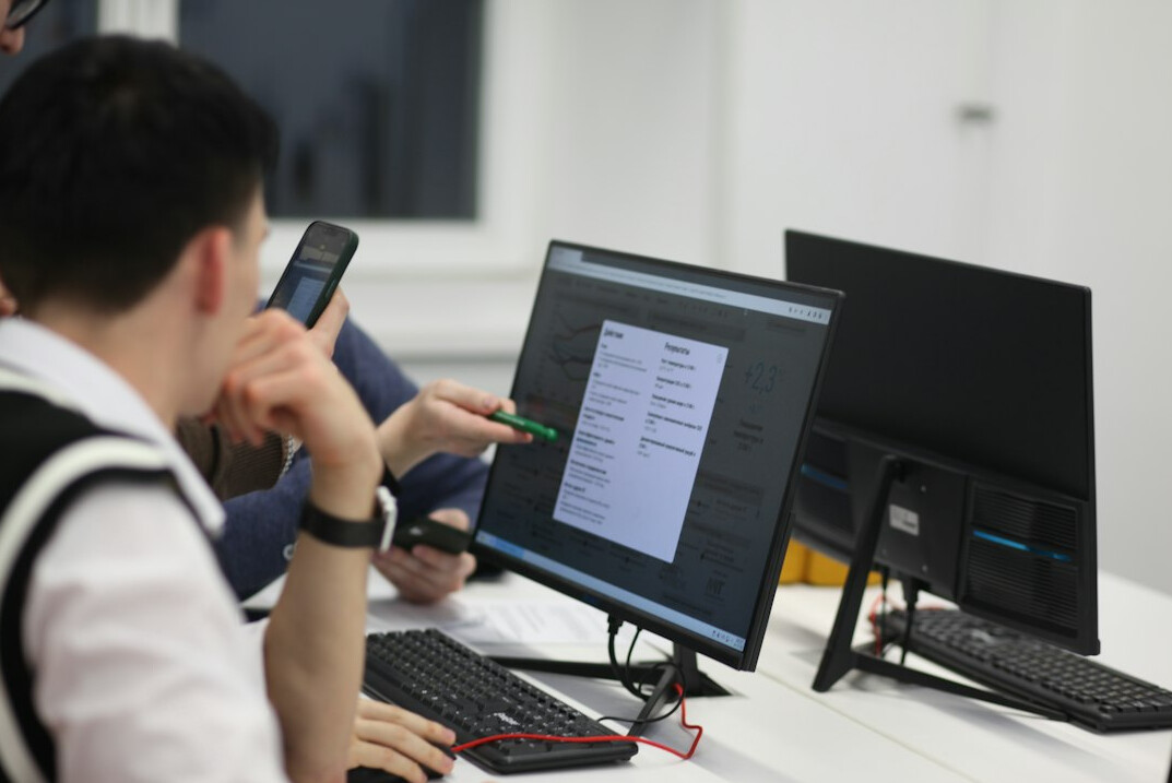 students coding together in classroom