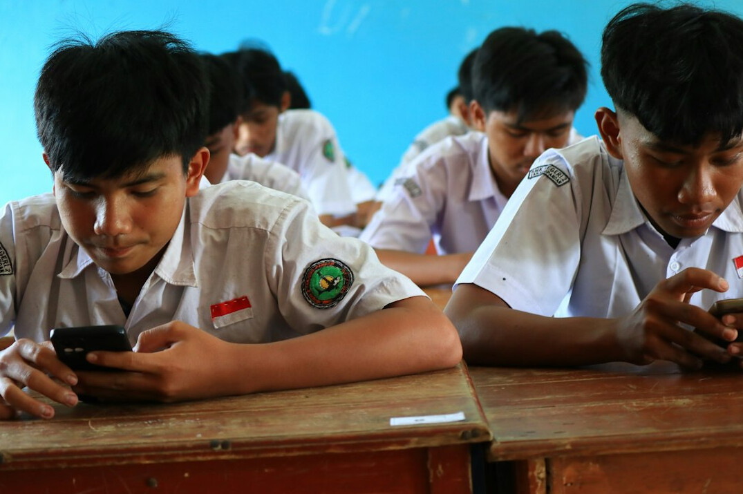 programming students in modern classroom