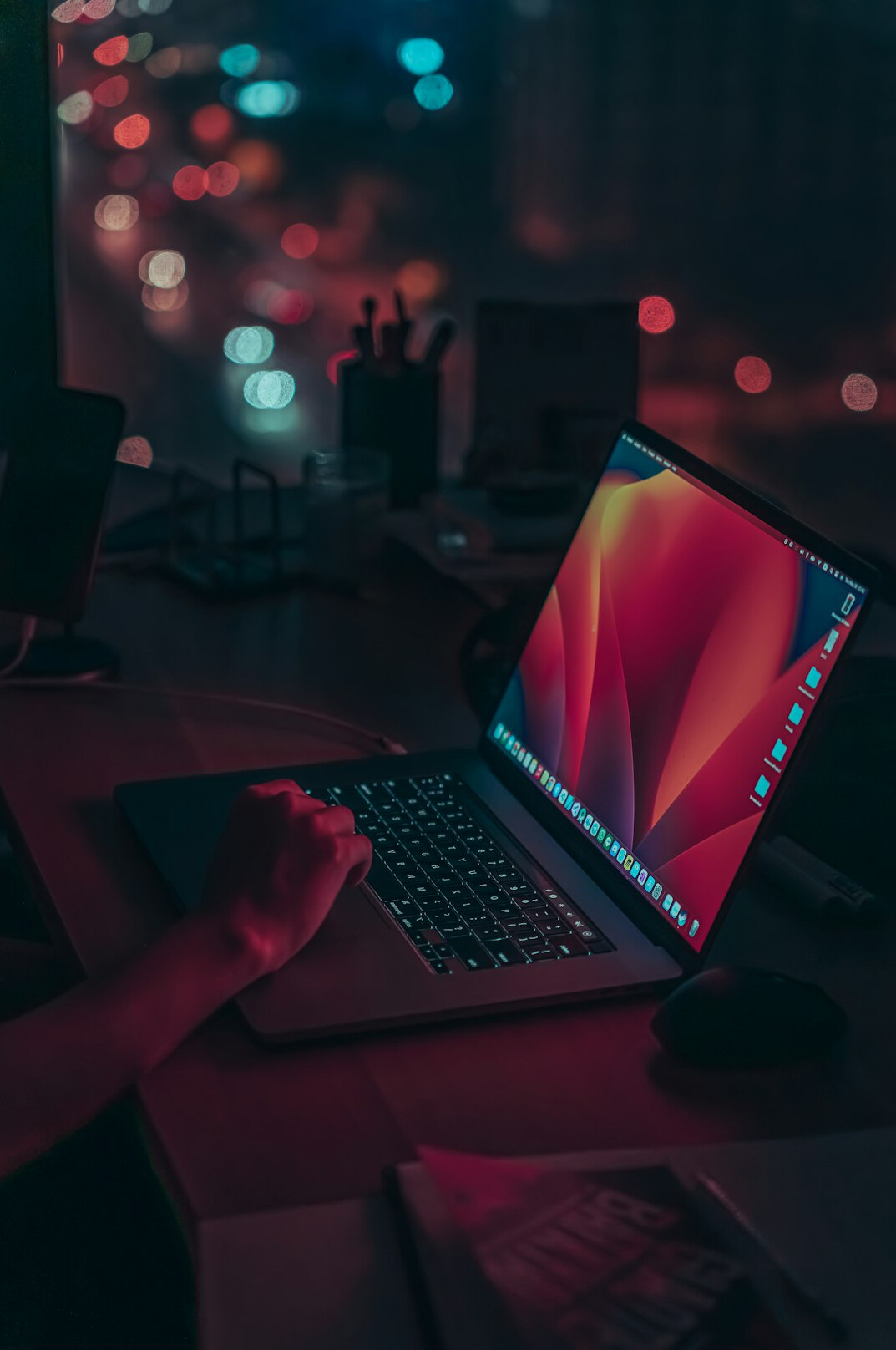 programmer typing on laptop